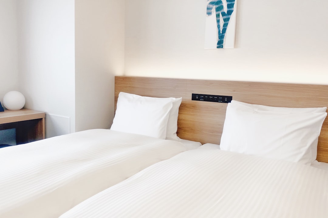 white-bed-pillow-on-bed-imbxscxyife